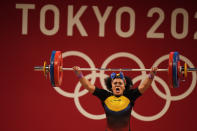 Neisi Patricia Dajomes Barrera of Ecuador competes in the women's 76kg weightlifting event, at the 2020 Summer Olympics, Sunday, Aug. 1, 2021, in Tokyo, Japan. (AP Photo/Luca Bruno)