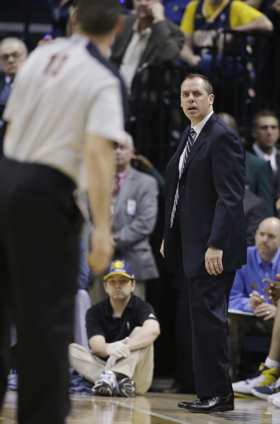 Indiana Pacers head coach Frank Vogel looks at referee Monty McCutchen after being called for a technical foul during the second half in Game 5 of an opening-round NBA basketball playoff series against the Atlanta Hawks Monday, April 28, 2014, in Indianapolis. Atlanta defeated Indiana 107-97. (AP Photo/Darron Cummings)