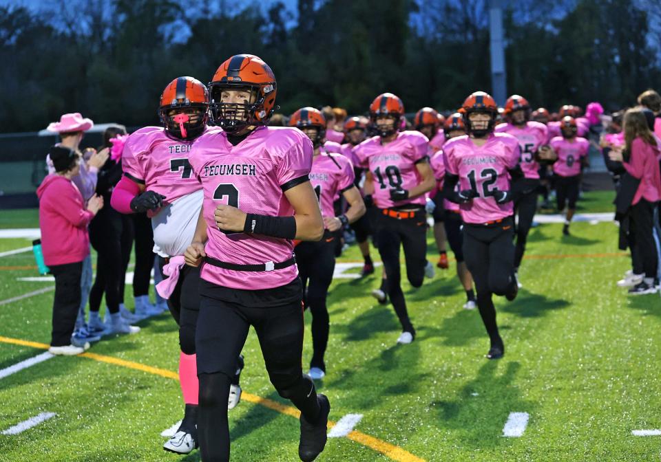 The Tecumseh football team takes the field prior to Friday's game against Kalamazoo Loy Norrix.