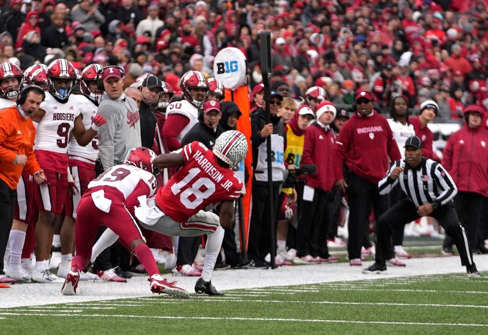 Nov 12, 2022; Columbus, Ohio, USA; Ohio State Buckeyes wide receiver Marvin Harrison Jr. (18) keeps one foot in bounds to make a complete pass during their NCAA Division I football game between the Ohio State Buckeyes and the Indiana Hoosiers at Ohio Stadium. Mandatory Credit: Brooke LaValley-The Columbus Dispatch