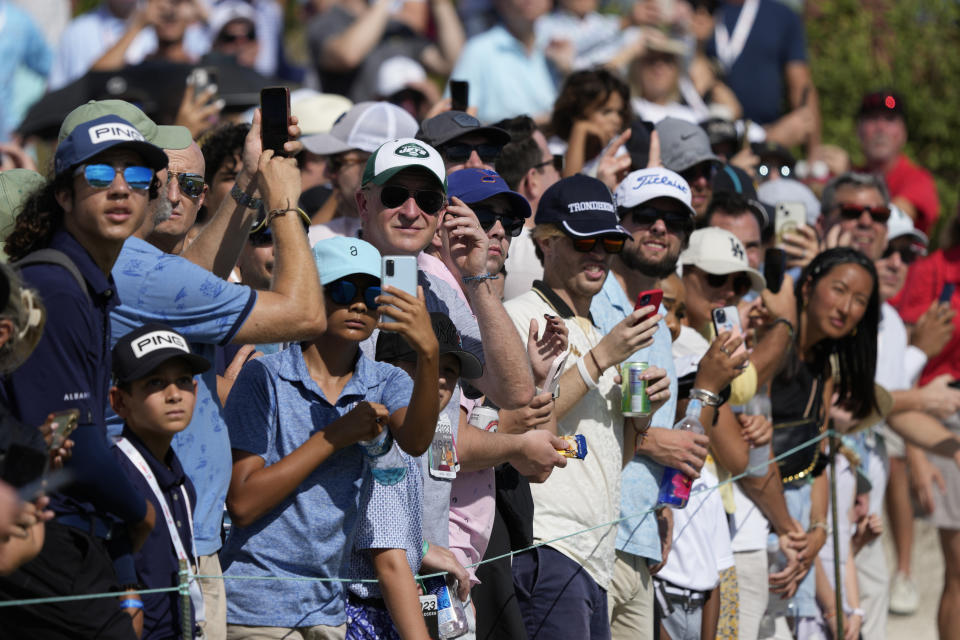 Tiger Woods' fans watch his wldshot on the second tee during the third round of the Hero World Challenge PGA Tour at the Albany Golf Club, in New Providence, Bahamas, Saturday, Dec. 2, 2023. (AP Photo/Fernando Llano)