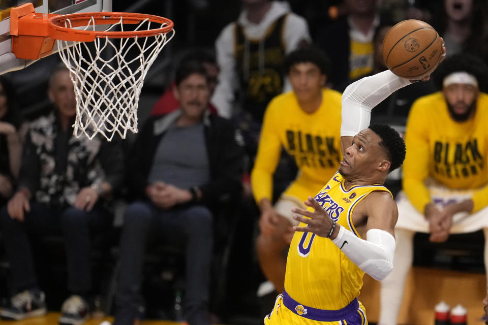 Los Angeles Lakers guard Russell Westbrook dunks during the first half of an NBA basketball game against the Oklahoma City Thunder Tuesday, Feb. 7, 2023, in Los Angeles. (AP Photo/Marcio Jose Sanchez)