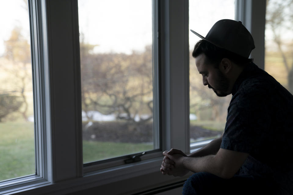 Gary Schaufeld pauses as he describes his time performing in dance competitions as a young performer, Thursday, Feb. 10, 2022, at his home in Port Jefferson, N.Y. Schaufeld stopped dancing years ago and has no plans to return to the studio. “It was my church,” he said, but now “the whole dance scene feels dirty and tainted.” (AP Photo/John Minchillo)