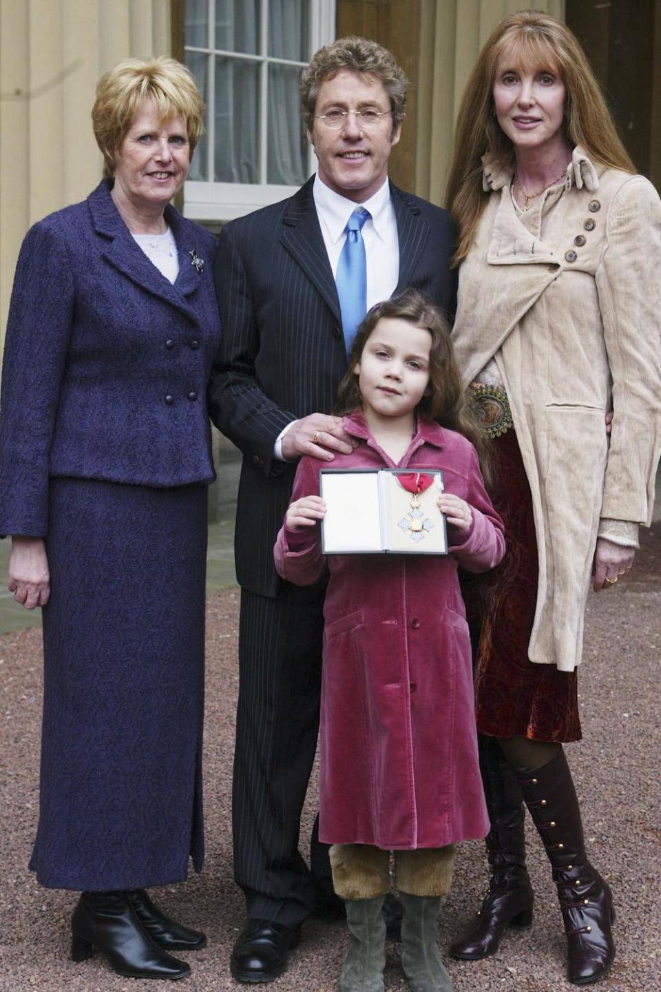 Roger Daltrey with granddaughter Lily, sister Jill Dale and wife Heather in 2005 (Tim Clarke-Royal Rota/Getty Images)