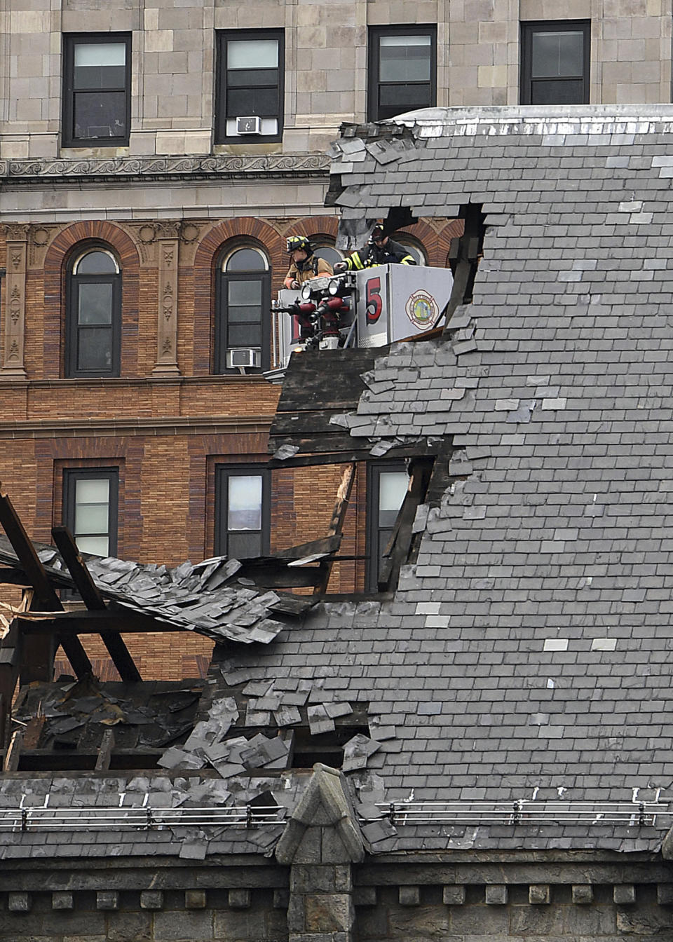 Emergency crews respond to the former First Congregational church after the steeple of the old, historic church collapsed, Thursday, Jan. 25, 2024, in New London, Conn. (Sarah Gordon/The Day via AP)