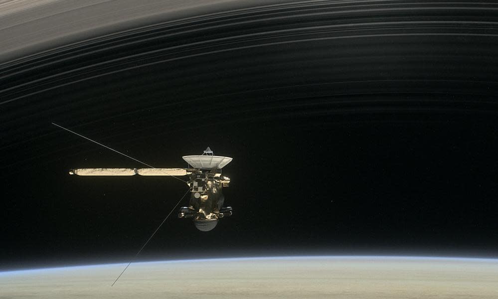 A still from the short film Cassini’s Grand Finale, with the spacecraft diving between Saturn and the planet’s innermost ring