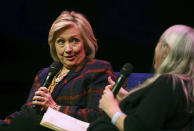 US former Secretary of State Hillary Clinton, left, talks to Classicist Mary Beard, at the Southbank Centre in London during the launch of Gutsy Women: Favorite Stories of Courage and Resilience, a book by Chelsea and Hillary Clinton, in London, Sunday, Nov. 10, 2019. (Aaron Chown/PA via AP)