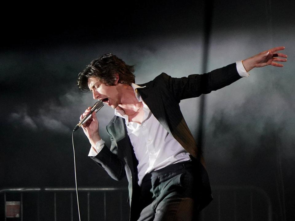 Alex Turner onstage with the Arctic Monkeys at Glastonbury (PA)