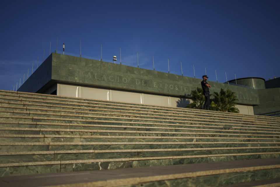 A police officer stands guard in front of the Congress center in Granada, southern Spain, Wednesday, Oct. 4, 2023. Almost all of Europe's leaders will gather Thursday in and around one of the most renowned havens of tranquility Spain's Alhambra Palace seeking to fix their increasingly turbulent and violent continent which is seeing war and political instability starting to unhinge nations and institutions. (AP Photo/Manu Fernandez)