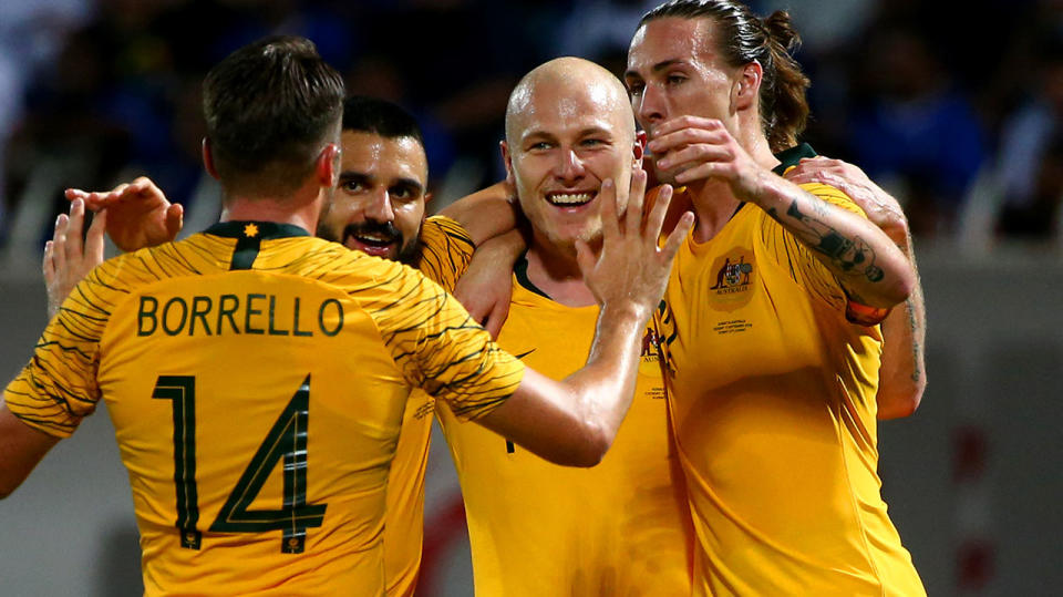 The Socceroos, pictured here celebrating their win over Kuwait.