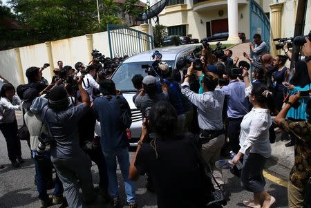 Members of the media surround a North Korea official's car as it leaves the North Korea embassy in Kuala Lumpur, Malaysia, February 22, 2017. REUTERS/Athit Perawongmetha