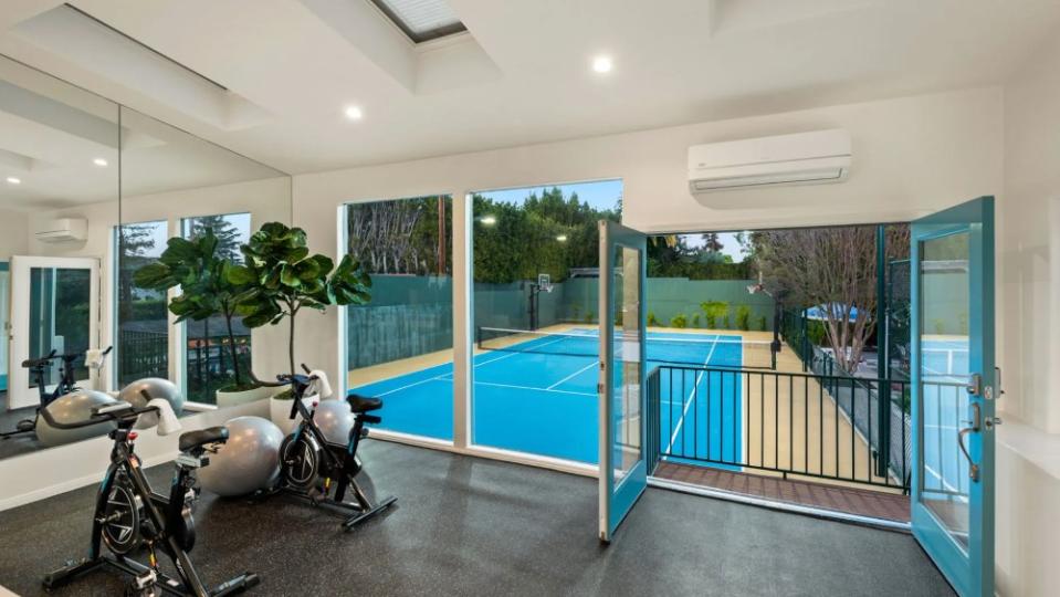 The fitness room opens onto the tennis court. - Credit: Beverly Hills Estates