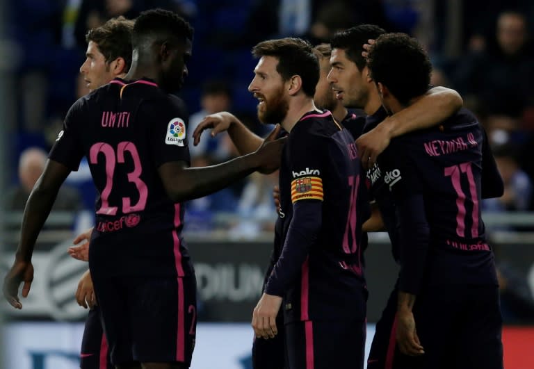 Barcelona's Luis Suarez (2ndR) celebrates with teammates after scoring his team's third goal during their Spanish league football match against Espanyol on April 29, 2017