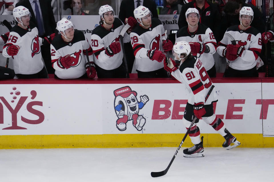 New Jersey Devils center Dawson Mercer (91) celebrates with teammates after scoring during the first period of an NHL hockey game against the Chicago Blackhawks in Chicago, Sunday, Nov. 5, 2023. (AP Photo/Nam Y. Huh)