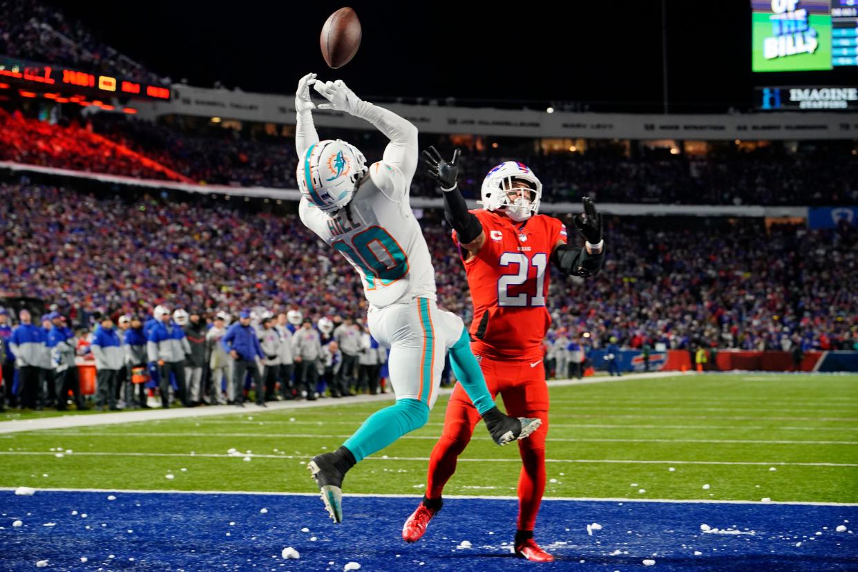 Buffalo's Jordan Poyer defends against the Dolphins' Tyreek Hill.