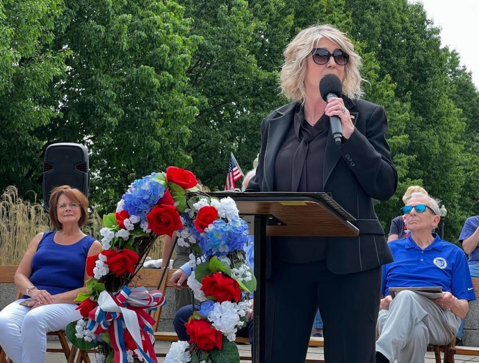 De Ann M. Williams, executive director of the Veterans Service Commission of Stark County, speaks at Monday's Memorial Day observance in Canton following a parade.