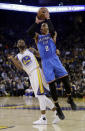 Oklahoma City Thunder's Russell Westbrook (0) shoots past Golden State Warriors' Ian Clark (21) during the first half of an NBA basketball game Wednesday, Jan. 18, 2017, in Oakland, Calif. (AP Photo/Marcio Jose Sanchez)