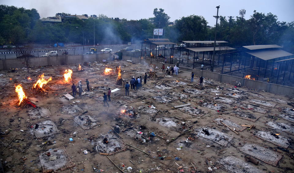  A general view over mass funerals at funeral pyres for COVID-19 victims at a makeshift cremation ground in New Delhi,  India, 01 May 2021.