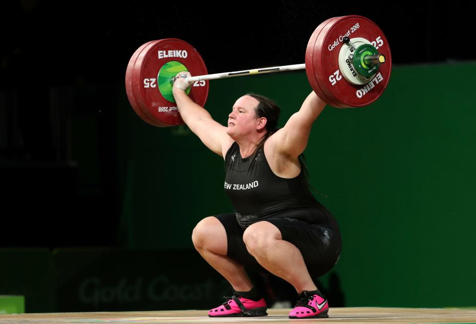 New Zealand's Laurel Hubbard lifts in the snatch of the women's +90kg weightlifting final at the 2018 Commonwealth Games on the Gold Coast, Australia. Hubbard will be the first transgender athlete to compete at the Olympics. Hubbard is among five athletes confirmed on New Zealand's weightlifting team for the Tokyo Games.