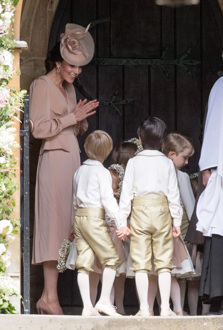 Kate shares a sweet moment with the children before entering the church [Photo: PA]