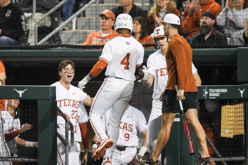 Teammates cheer after Texas outfielder Porter Brown scores a run in the Longhorns' Feb. 16 win over San Diego at UFCU Disch-Falk Field. Porter hit a three-run home run Friday night in Texas' 22-8 win at Texas Tech, both teams' Big 12 opener.