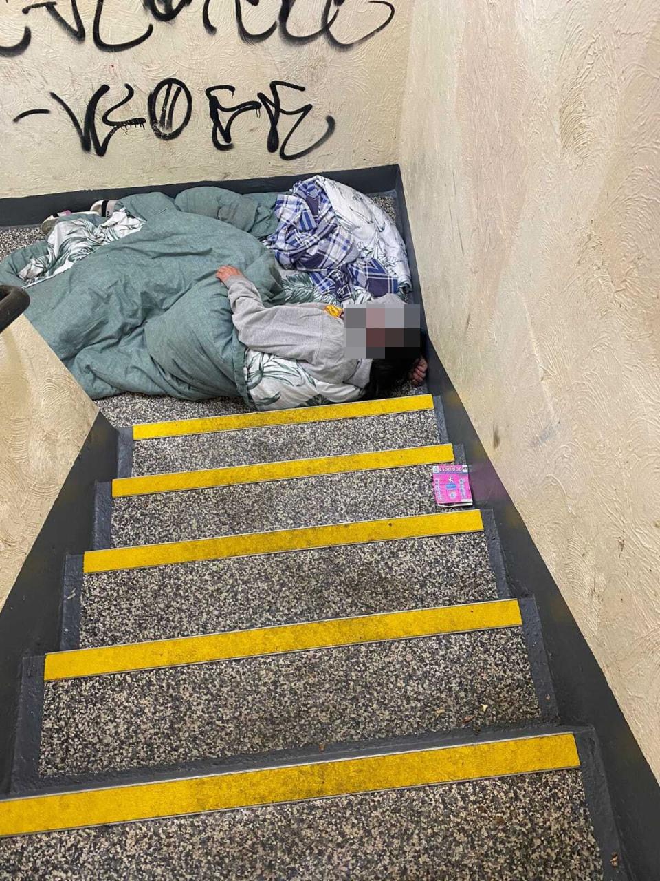 A person sleeping in the stairwell of Milford Towers (Supplied)