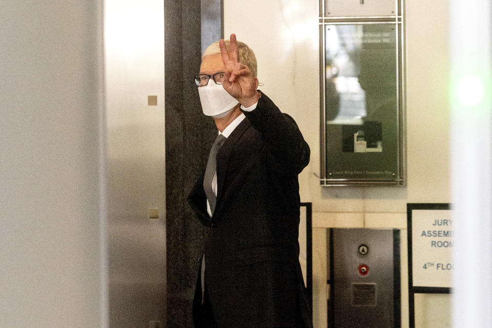 Apple CEO Tim Cook leaves the Ronald V. Dellums building in Oakland, Calif., after testifying in a federal court case brought by Epic Games on Friday, May 21, 2021. Epic, maker of the video game Fortnite, charges that Apple has transformed its App Store into an illegal monopoly. (AP Photo/Noah Berger)