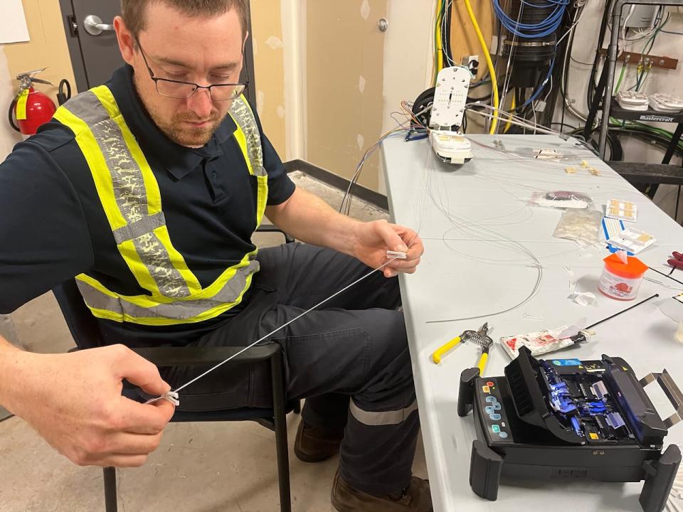 Chris Cossaboon works on the fibre network for the Municipality of Pictou County