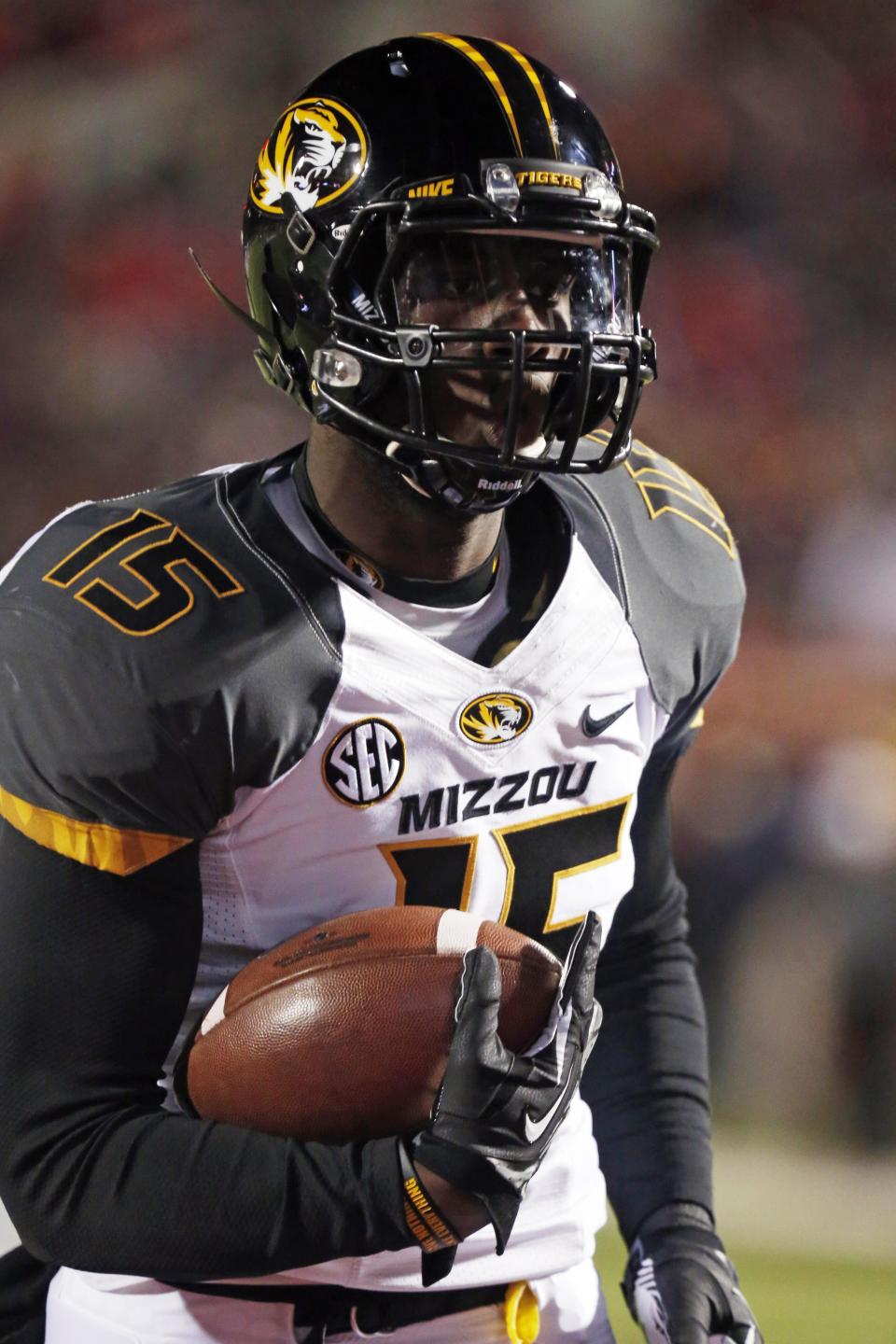 FILE - In this Nov. 23, 2013, file photo, Missouri wide receiver Dorial Green-Beckham runs with a caught pass during pre-game drills before an NCAA college football game against Mississippi in Oxford, Miss. Dorial Green-Beckham was suspended indefinitely Monday, April 7, 2014, for an unspecified violation of team rules, three months after he and two friends were arrested on suspicion of felony drug distribution when police found a pound of marijuana in their car. Coach Gary Pinkel announced the suspension without mentioning the January incident in which the standout receiver was arrested in his Missouri hometown of Springfield. (AP Photo/Rogelio V. Solis, File)