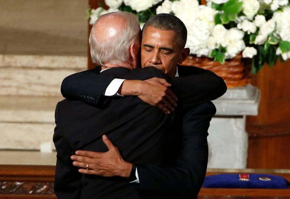 President Barack Obama hugs Vice President Joe Biden during funeral services for Biden's son, Beau Biden, in 2015.