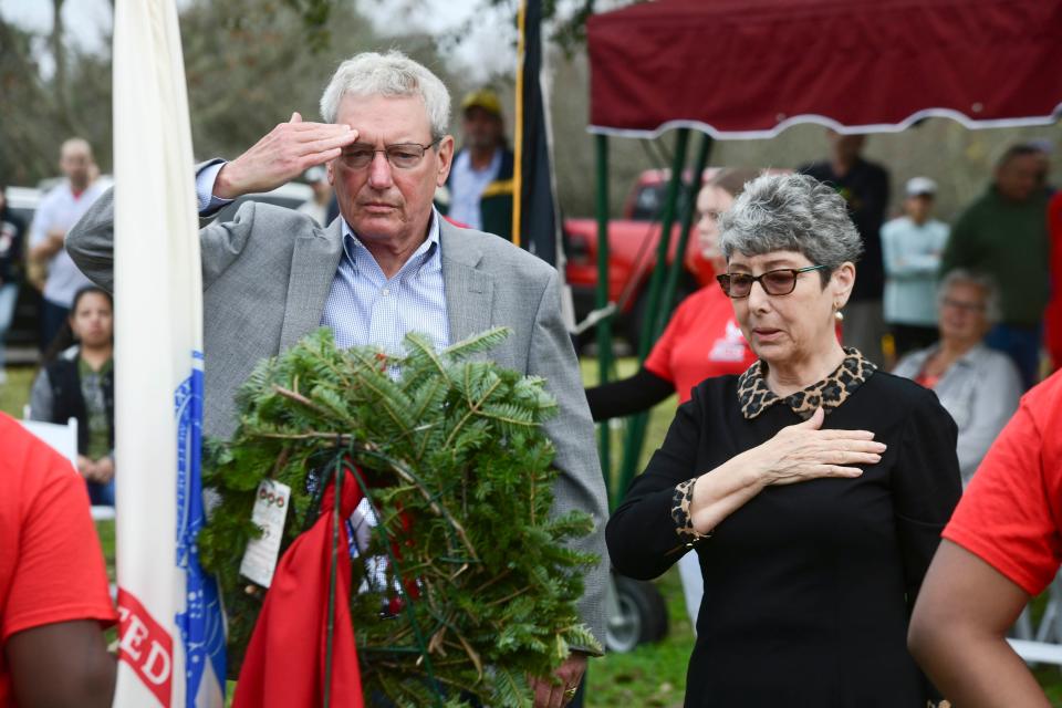 Mark and Michele Lombardo, children of retired U.S. Army Lt. Col. Sam Lombardo salute a wreath dedicated in memory to U.S. Army veterans during Saturdays Wreaths Across America event held at Beal Memorial Cemetery. World War II veteran Sam Lombardo died June 11 of this year, at the age of 101.