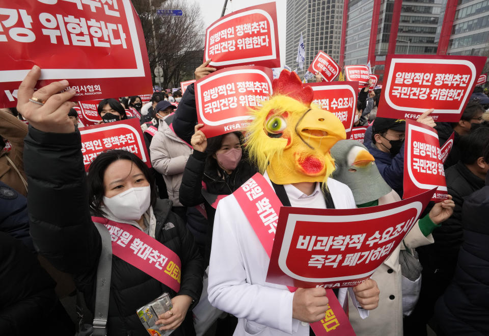 A doctors wearing a mask attends a rally against the government's medical policy in Seoul, South Korea, Sunday, March. 3, 2024. Thousands of senior doctors rallied in Seoul on Sunday to express their support for junior doctors who have been on strike for nearly two weeks over a government plan to sharply increase the number of medical school admissions. (AP Photo/Ahn Young-joon)