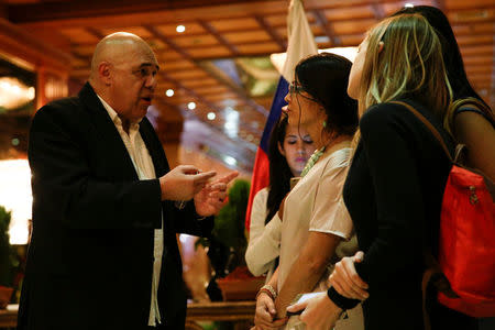 Jesus Torrealba (L), secretary of Venezuela's coalition of opposition parties (MUD), talks to the media after his meeting with international mediators for talks between government and opposition in Caracas, Venezuela December 6, 2016. REUTERS/Marco Bello