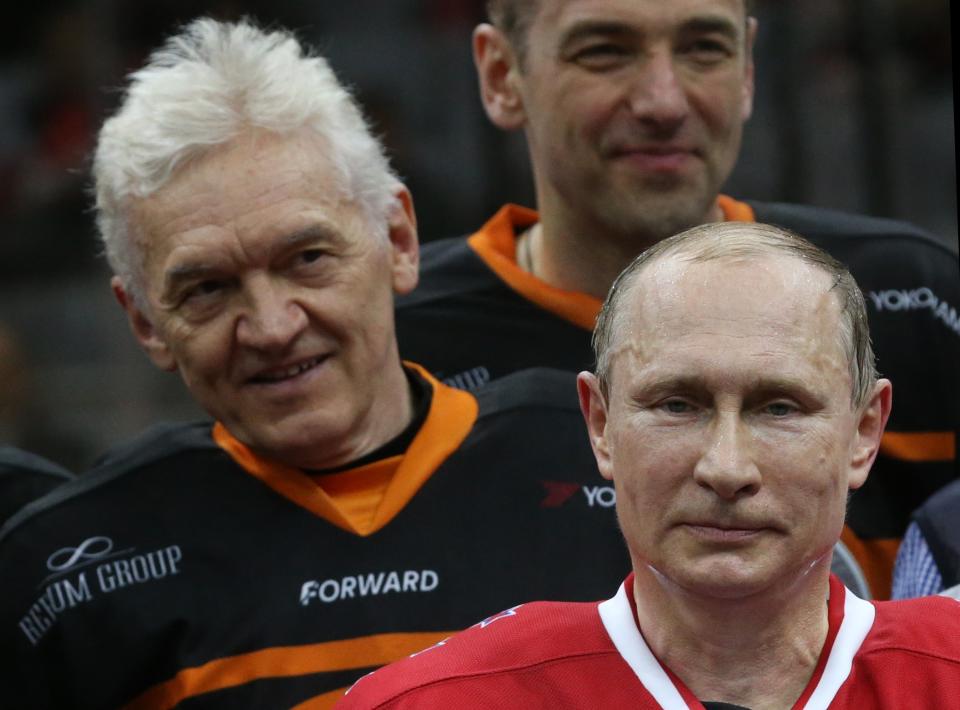 SOCHI, RUSSIA - MAY 16: President Vladimir Putin of Russia poses with businessmen and billionaires Arkady Rotemberg (L) and Gennady Timchenko (C) during a Nignt Hockey League match on May 16, 2015 in Sochi, Russia. Putin was joined by fellow politicians, businessmen and retired NHL players. Putin's team won 18-6, with eight goals scored by Putin. (Photo by Sasha Mordovets/Getty Images)