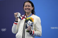 Siobhan Bernadette Haughey of Hong Kong holds up her silver medal from the women's 200-meter freestyle final at the 2020 Summer Olympics, Wednesday, July 28, 2021, in Tokyo, Japan. (AP Photo/Matthias Schrader)