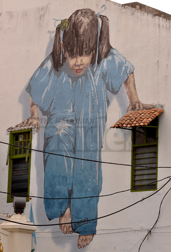 An imposing picture of a girl in pastel colours at Muntri Street, George Town. – The Malaysian Insider pic by Hasnoor Hussain, November 22, 2013. 