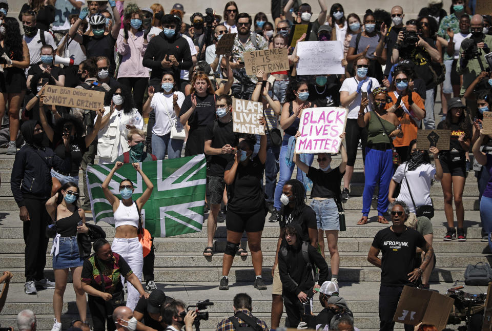 People gather in Trafalgar Square in central London on Sunday, May 31, 2020 to protest against the recent killing of George Floyd by police officers in Minneapolis that has led to protests across the US. (AP Photo/Matt Dunham)