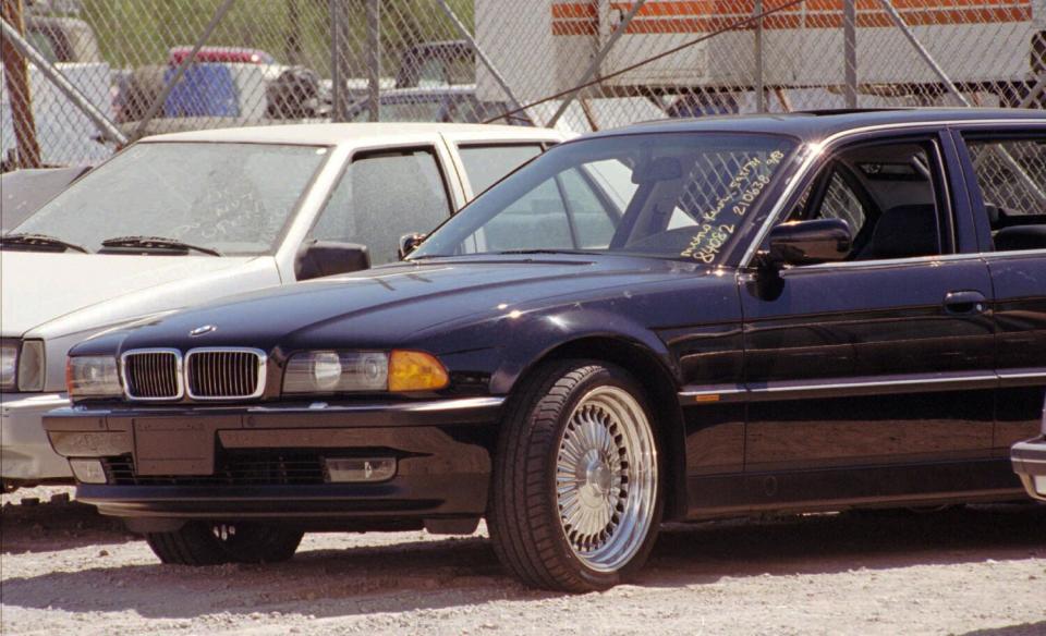 A BMW, riddled with bullet holes, in a Las Vegas police impound lot