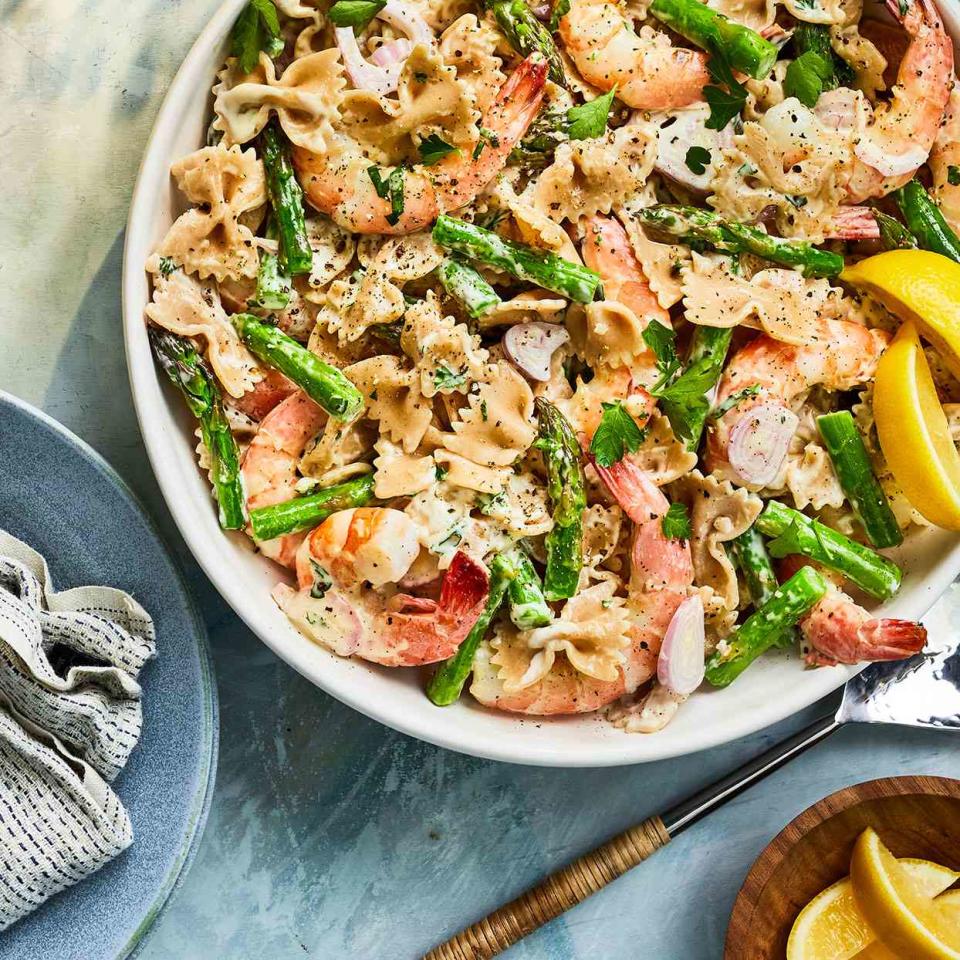 <p>This fresh and bright cold shrimp pasta salad features classic shrimp scampi flavors. Lemon and Dijon mustard brighten the dressing, and asparagus adds a nice crunch. Farfalle pasta works well with this dish, but any medium pasta shape will work.</p> <p> <a href="https://www.eatingwell.com/recipe/279263/shrimp-pasta-salad/" rel="nofollow noopener" target="_blank" data-ylk="slk:View Recipe;elm:context_link;itc:0;sec:content-canvas" class="link ">View Recipe</a></p>