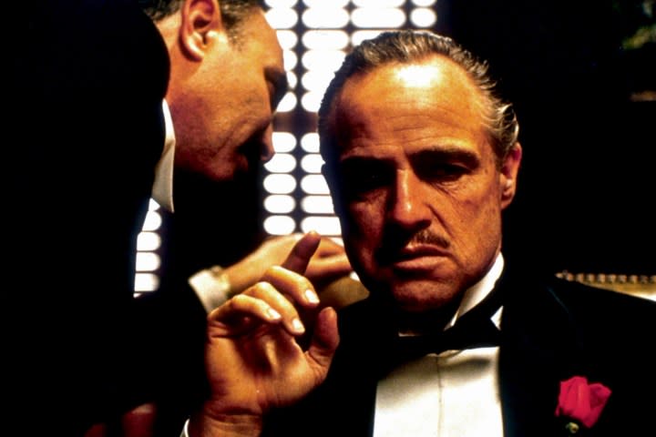 Marlon Brando listens to counsel in a scene from "The Godfather."