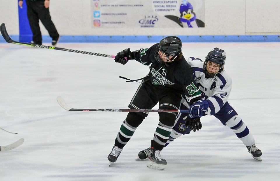 Somerset Berkley’s Luke Gauvin stops Dartmouth’s Aiden Cruz from recovering the puck .