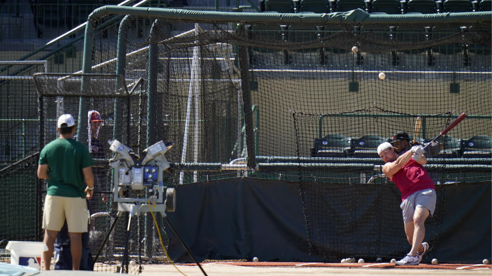 New York Yankees infielder Luke Voit fouls off a pitch during informal baseball workout at the University of South Florida Thursday, Feb. 24, 2022, in Tampa, Fla. (AP Photo/Chris O'Meara)