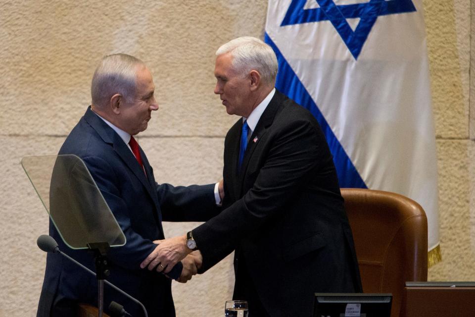Israel's Prime Minister Benjamin Netanyahu, left, shakes hands with U.S. Vice President Mike Pence in Israel's parliament in Jerusalem, Jan. 22, 2018.