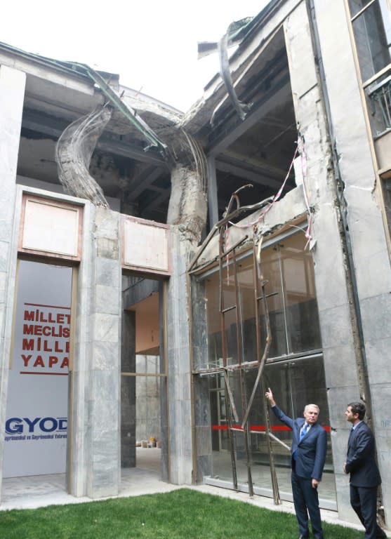 French Foreign minister Jean-Marc Ayrault (L) visited the Turkish parliament, damaged during the failed coup, on October 24, 2016