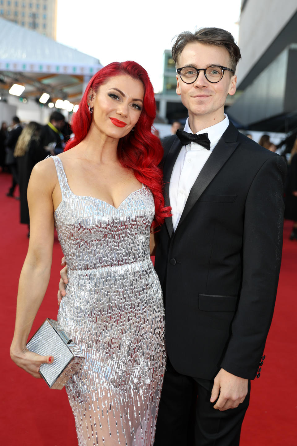 Dianne Buswell sparkles in sequins as she cuddles up to Joe Sugg