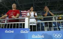 2016 Rio Olympics - Taekwondo - Preliminary - Men's -80kg Preliminary Round - Carioca Arena 3 - Rio de Janeiro, Brazil - 19/08/2016. Mark Lopez cheers on his brother Steven Lopez (USA) of USA (not pictured). REUTERS/Issei Kato