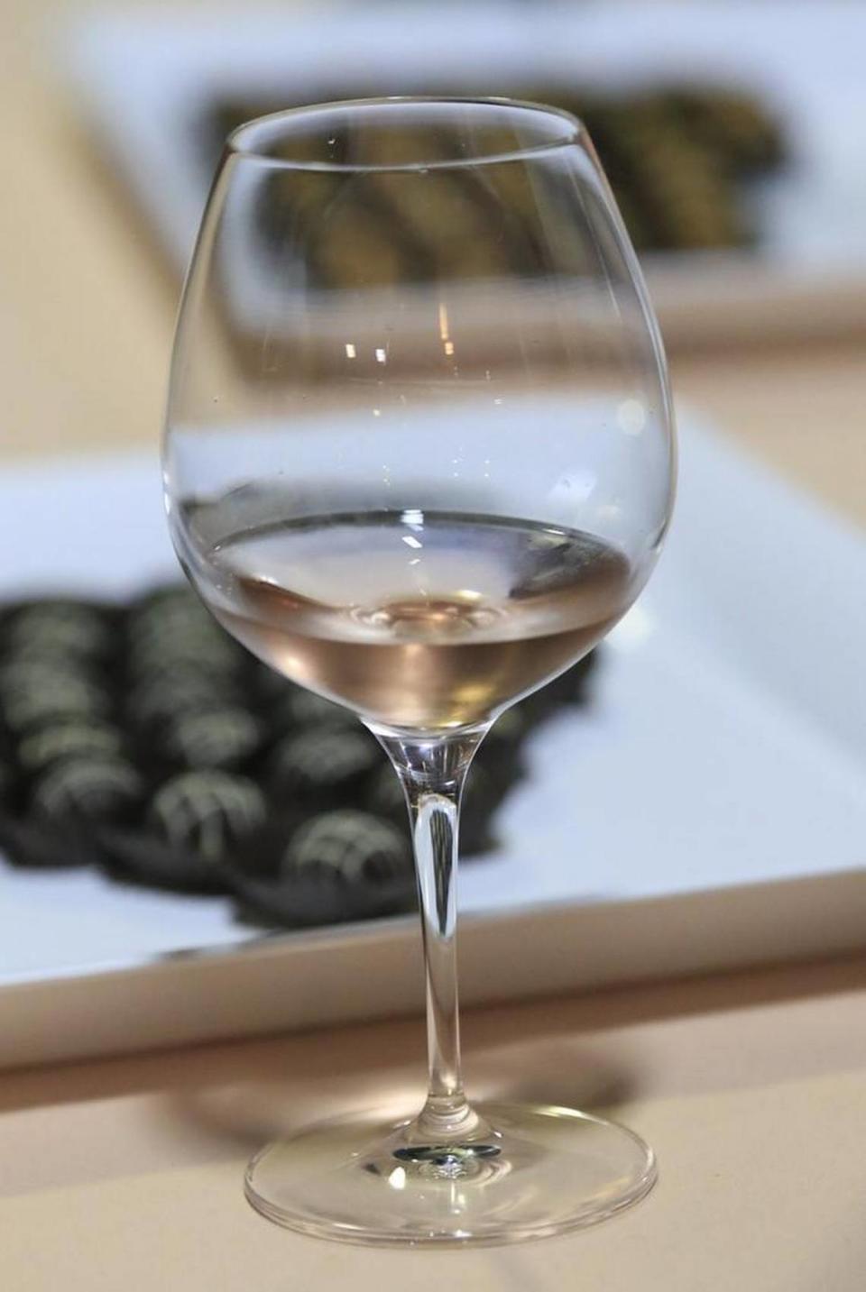 A glass of Chamisal Vineyards’ 2016 Rosé is paired with chocolates at a Feb. 10, 2017 release party at the San Luis Obispo winery’s Orcutt Road production facility.