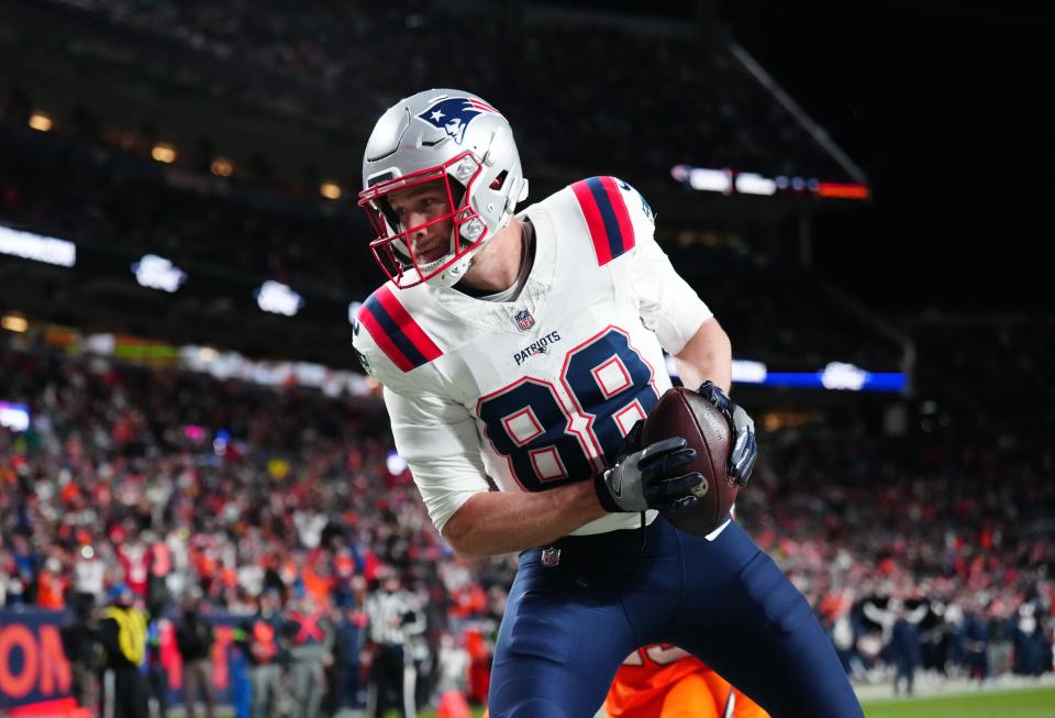 Dec 24, 2023; Denver, Colorado, USA; New England Patriots tight end Mike Gesicki (88) pulls in a touchdown reception in the third quarter against the Denver Broncos at Empower Field at Mile High. Mandatory Credit: Ron Chenoy-USA TODAY Sports