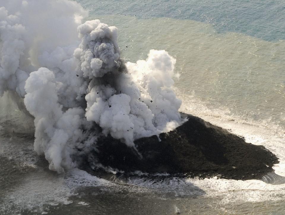 Smoke from an erupting undersea volcano forms a new island off the coast of Nishinoshima in the southern Ogasawara chain of islands