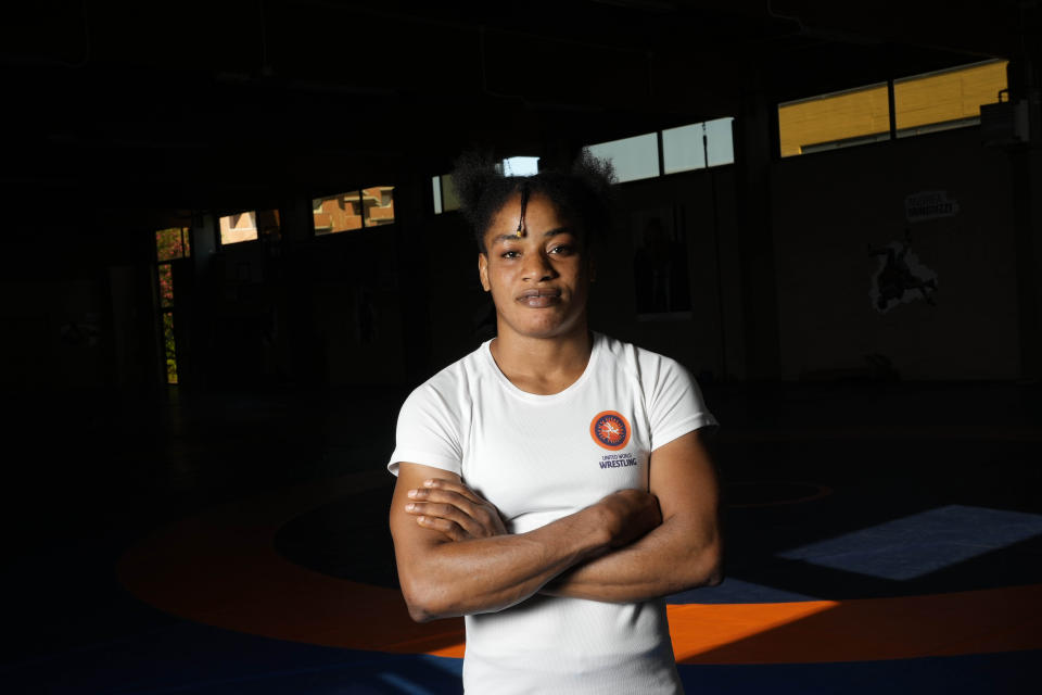 Guinean wrestler Fatoumata Yarie Camara poses for a portrait before the start of her afternoon training session in Ostia, near Rome, Monday, July 5, 2021. A West African wrestler's dream of competing in the Olympics has come down to a plane ticket. Fatoumata Yarie Camara is the only Guinean athlete to qualify for these Games. She was ready for Tokyo, but confusion over travel reigned for weeks. The 25-year-old and her family can't afford it. Guinean officials promised a ticket, but at the last minute announced a withdrawal from the Olympics over COVID-19 concerns. Under international pressure, Guinea reversed its decision. (AP Photo/Alessandra Tarantino)